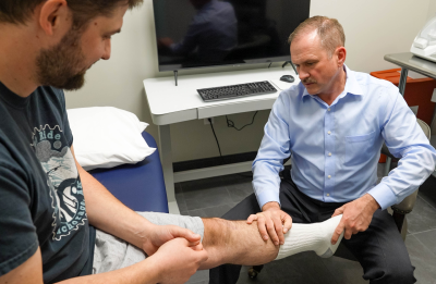 reception area with a marble counter top in front of a window